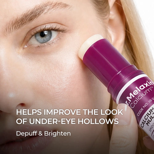 Close-up of the balm stick being swiped under a model's eye