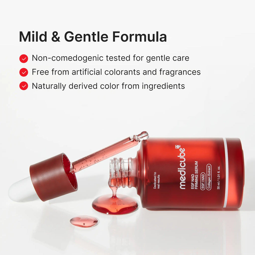 Serum bottle on its side with the dropper out and a drop of red serum pooled beside it